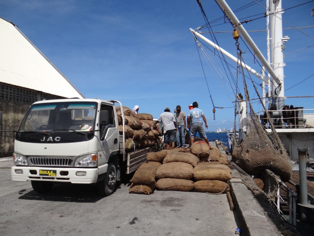 Bags of copra being offloaded for milling at the Tobolar Copra Processing Authority plant in Majuro.