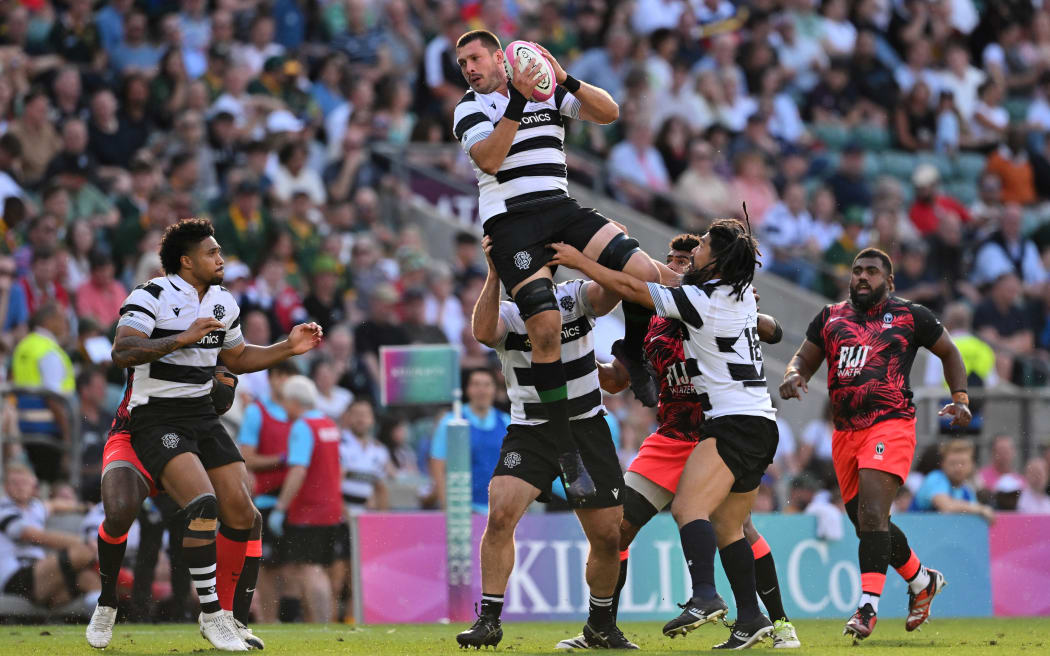 Barbarian's New Zealand lock Liam Mitchell catches the ball during the International rugby union match between Barbarians and Fiji at Twickenham Stadium, south-west London, on June 22, 2024. (Photo by Glyn KIRK / AFP)