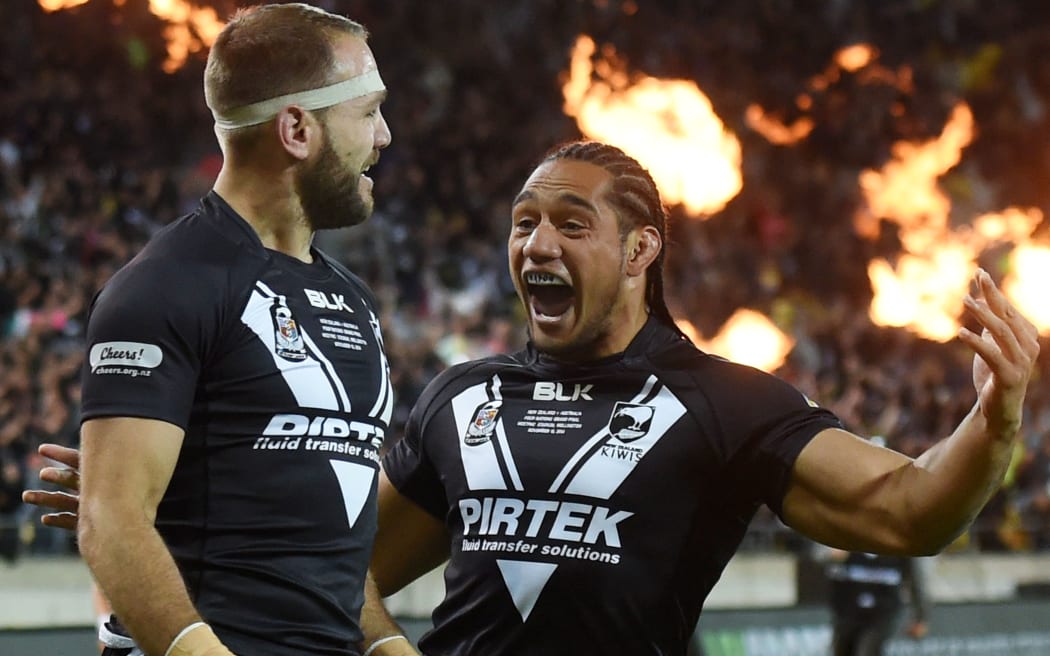 Wing Jason Nightingale scores a try and celebrates with his Kiwis team-mate Martin Taupau.