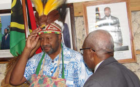 Vanuatu prime minister Charlot Salwai accepts traditional head dress from the United Liberation Movement for West Papua.