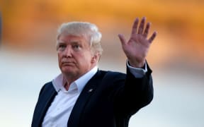 Donald Trump the 45th president of the United States waves to the crowd after the final round of the 2017 Presidents Cup in Jersey City.