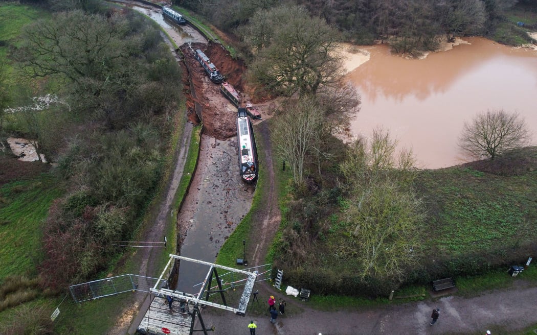 A sinkhole has developed in a canal in the county of Shropshire, England, prompting rescue operations.