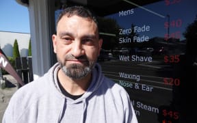 Anchor Barbershop owner Tammam Tamim says his takings are well down.