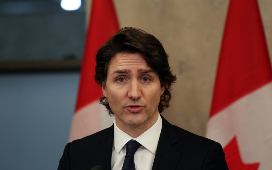 Canada's Prime Minister Justin Trudeau speaks with reporters during a news conference on Parliament Hill February 11, 2022 in Ottawa, Canada.