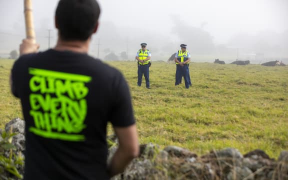 Protester and police at Ihumatao.