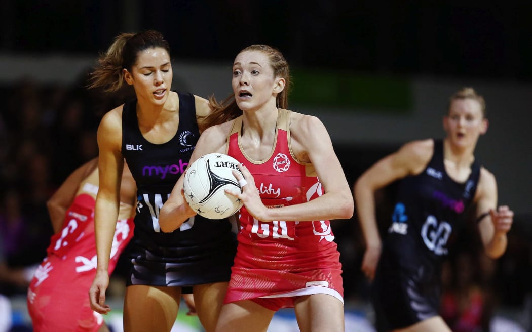 Helen Housby of England with the ball.