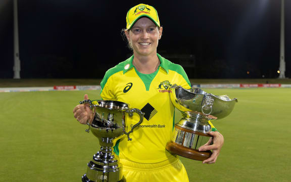 Australia's captain Meg Lanning holds the DJ Gardner ODI series trophy and Rose Bowl trophy after their series win over New Zealand 2021.