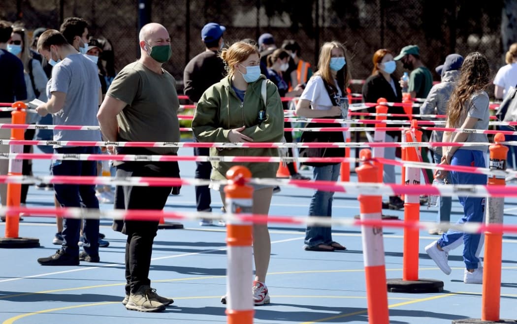 People queue at a Covid-19 vaccination centre in Melbourne on September 1, 2021, after Australia's economy expanded more than expected in the second quarter,