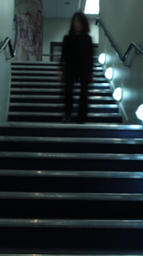 'Get up out of your chair and regularly walk along the corridor or up and down the stairs' - that's the advice from researchers who say spending too much time sitting is bad for our health. Photo of person walking down the stairs.