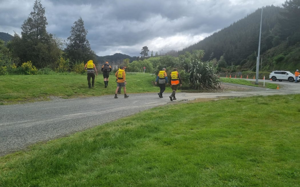 Emergency services at the scene in Tuamarina, where a car drove into a river, October 2024.