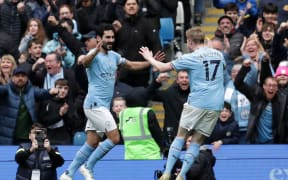 Ilkay Gundogan (L) of Manchester City celebrates scoring.