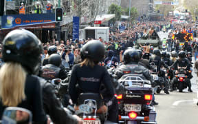 Crowds watch Boobs on Bikes' parade of topless women down Queen Street in 2006.
