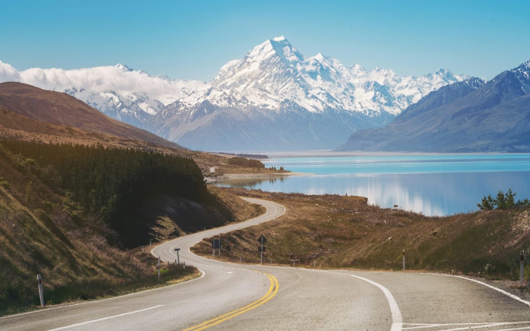 A winding road near a scenic travel route in New Zealand.