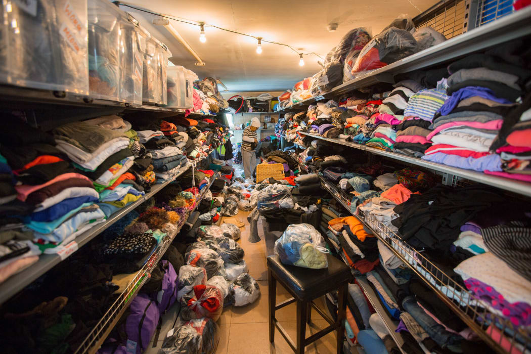 Clothing that has been donated to Te Puea Marae is sorted.