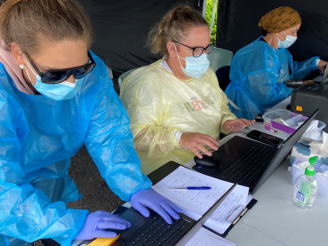On the laptops at Ngāti Ruanui’s pop-up Covid-19 saliva testing station in Eltham were (from left) Tineka Kumeroa, Justine Stewart and Debbie Ngarewa-Packer.