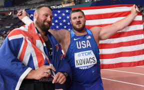 Third placed New Zealand's Tomas Walsh (L) and winner USA's Joe Kovacs pose after the Men's Shot Put final at the 2019 IAAF Athletics World Championships at the Khalifa International stadium in Doha on October 5, 2019.
