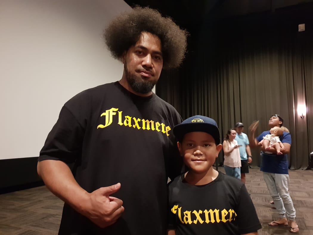 Peleti Oli, with his son Jesiah Oli, hopes to inspire others after his inclusion in the Flaxmere Heroes Calendar.