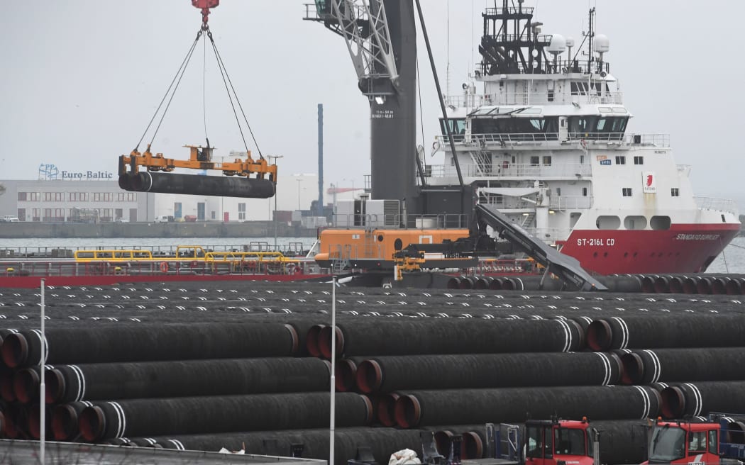 12 December 2019, Mecklenburg-Western Pomerania, Sassnitz: Pipes for the Nord Stream 2 Baltic Sea gas pipeline will be loaded onto a ship at the port of Mukran.