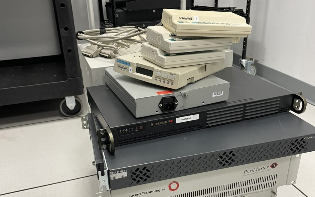 A trolley of 90s internet equipment in a sterile server room