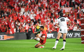 Tonga's Tevita Pangai Junior scores a try against Australia last year.