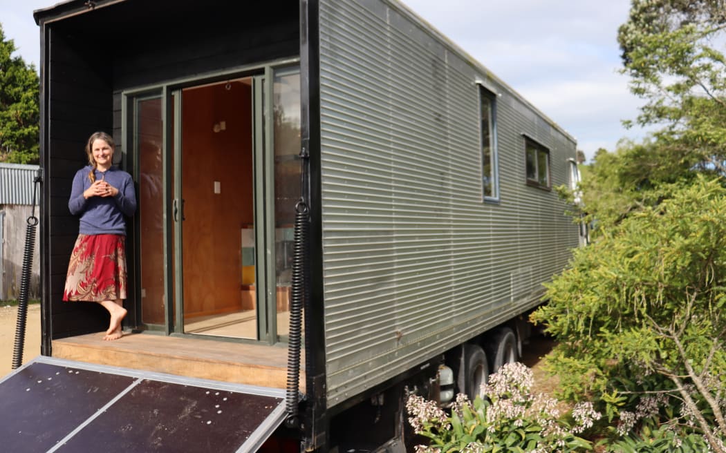 Kath Irvine on the porch of her housetruck