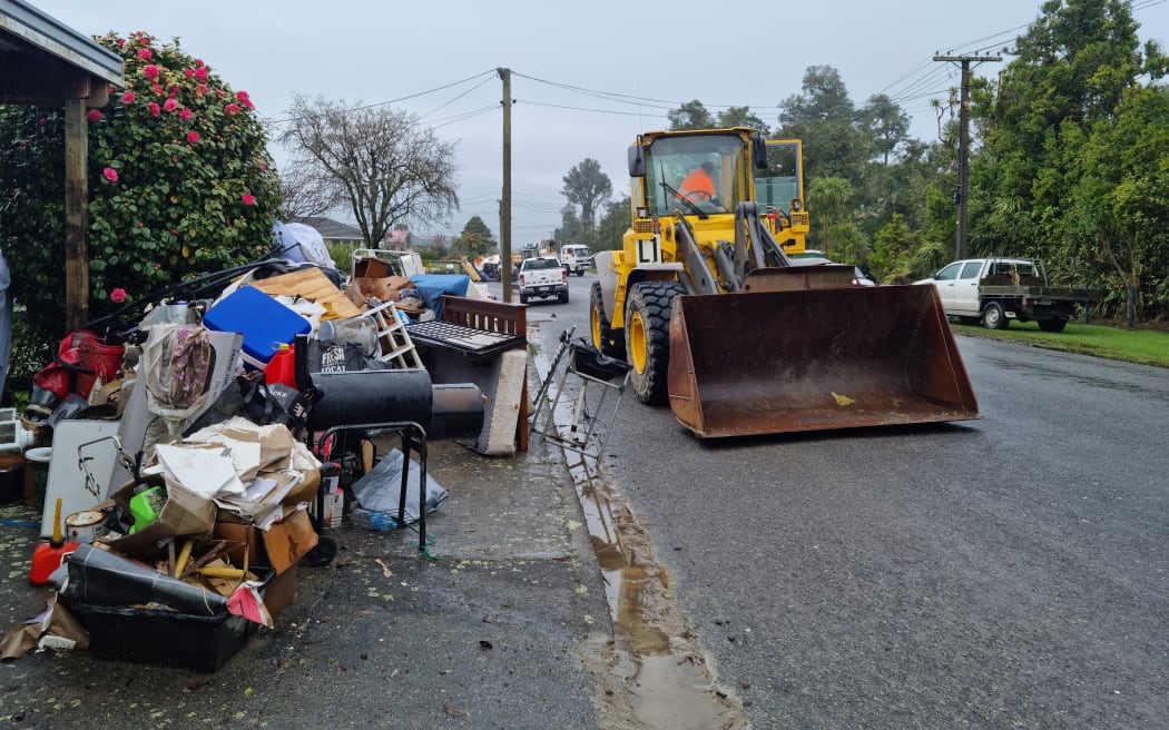 The New Zealand Defence Force, Buller District Council staff and Westreef contractors are working together to remove flood damaged items from homes in Westport.