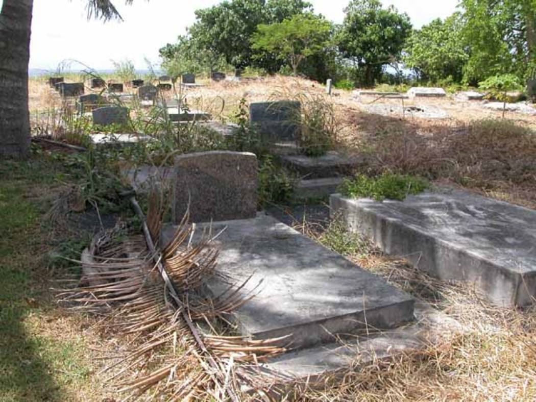 Overgrown graves at Nikao Cemetery in Rarotonga in 2003.
