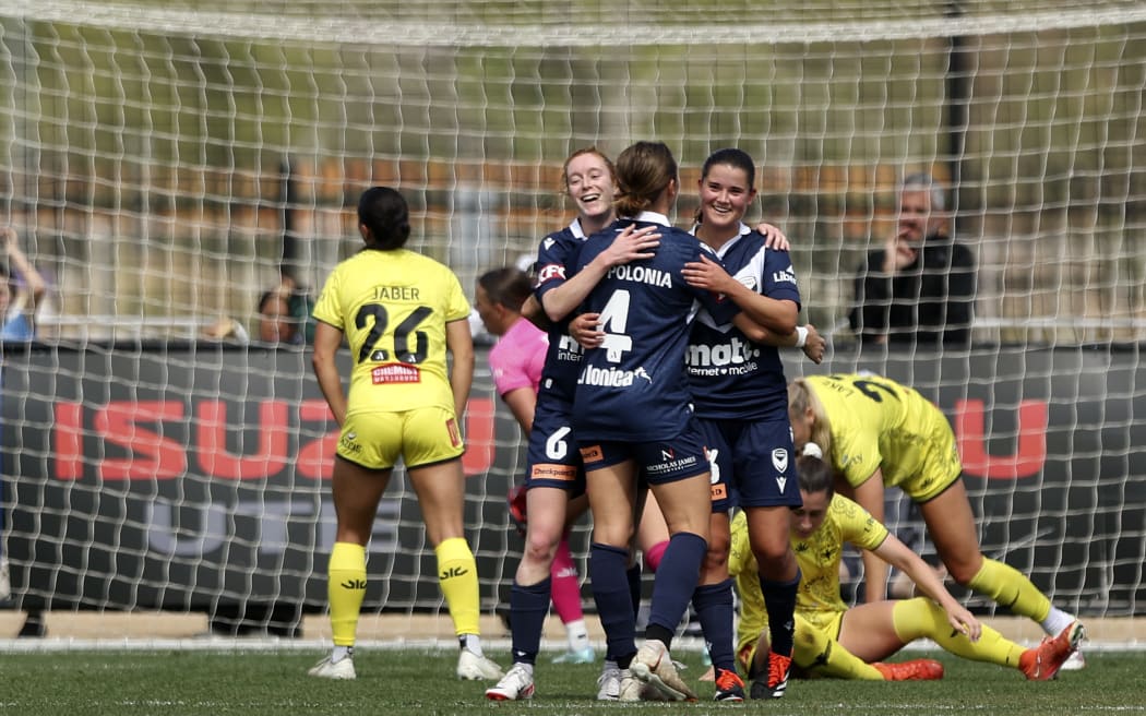 Rachel Lowe of the Victory celebrates a goal with teammates during the A-League Women.