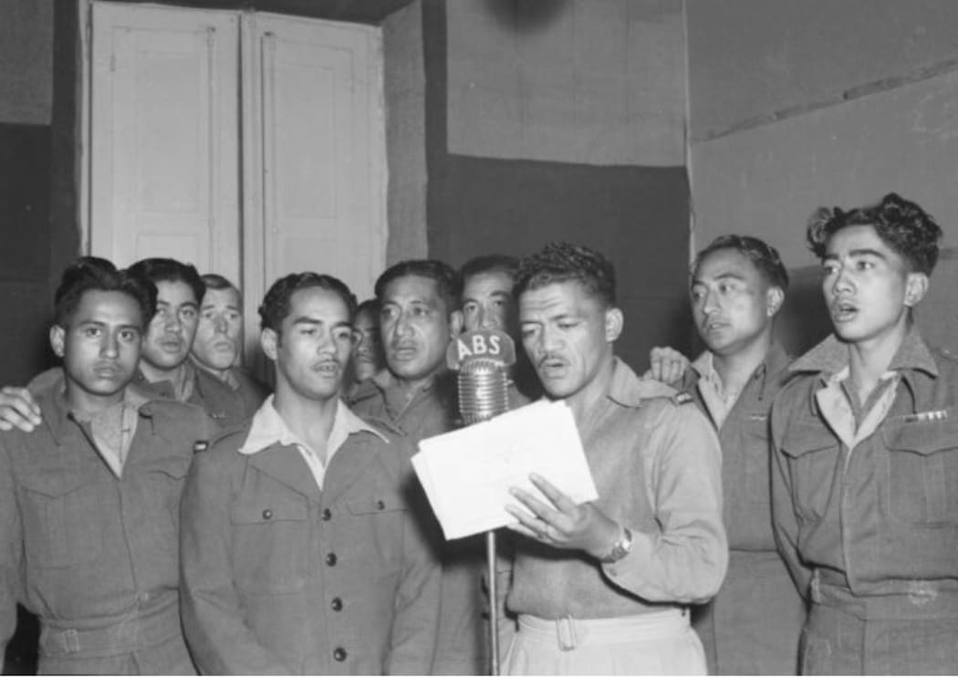 Winter, E E, active 1945. Awatea Maori Choir singing for the Kiwi Request Session at the British Forces Radio Station in Bari, Italy. Ref: DA-08473-F. Alexander Turnbull Library, Wellington, New Zealand. /records/22888595