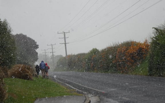 Dunedin locals caught out in a brief snow storm. 28 September 2020