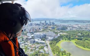 Prime Minister Chris Hipkins assesses the damage from the Auckland flooding from a helicopter on Saturday, 28 January.