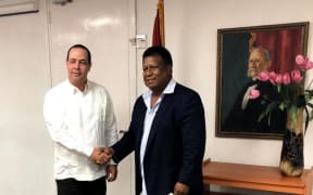 Cuba's Minister for Public Health Roberto Morales Ojeda( left) and Palau Health Minister Emais Roberts during a 2018 visit of Palau
