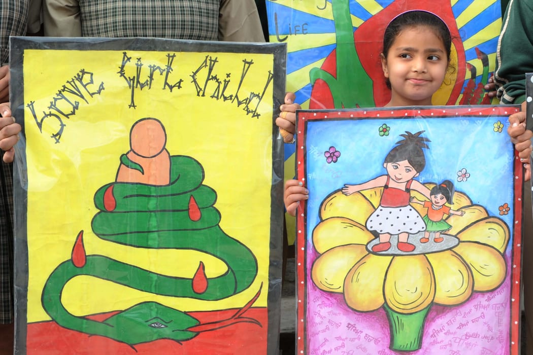 Girls participate in a protest against female foeticide, a practice that activists say is still rampant in India.