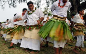 Tongan youth dance wearing traditional ta'ovala or woven waist mats.