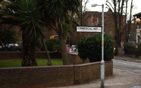A picture shows the site of missing Banksy artwork, a set of drones stencilled onto a "Stop" traffic sign, a graffiti artwork bearing the hallmarks of the famous street artist on a post in Peckham, south London on December 22, 2023. A work of art on a street sign in London suddenly disappeared on Friday, carried away by a running man just after being claimed by Banksy. (Photo by HENRY NICHOLLS / AFP)