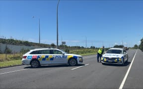 A police cordon at the corner of Sandhurst St and Truman lane, Mangatawa.