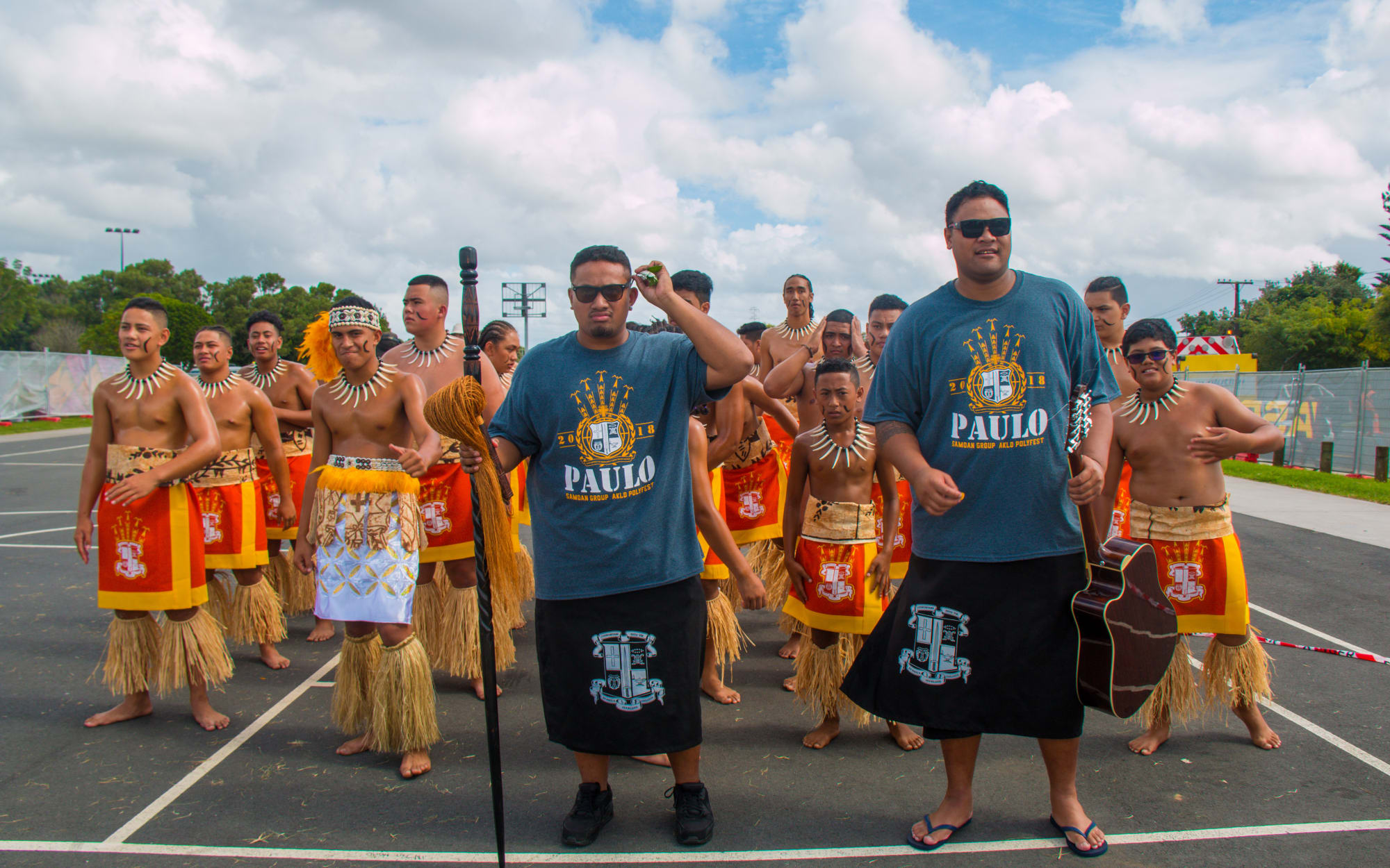 The St Paul's Samoan group, and tutors Francis Tanuvasa and Joe Alesi, wait to go on stage to compete at Polyfest.