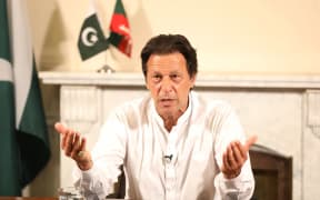 Pakistan's cricketer-turned politician Imran Khan, and head of the Pakistan Tehreek-e-Insaf party, addresses the nation at his residence in Islamabad a day after general election.