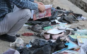 A view from the site after at least 30 people, mostly schoolgirls, have been killed in three back-to-back blasts targeting a school in Afghanistan's capital Kabul on 8 May 2021.