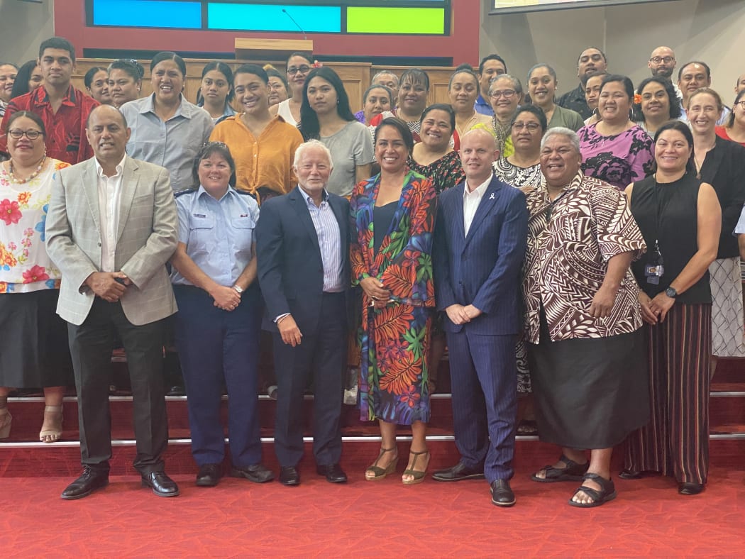 Guests with some of the graduates at the celebration in Mangere.