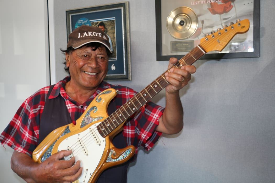 Dennis Marsh with one of his prized guitars.