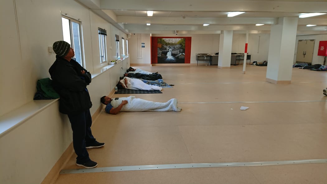Some New Zealanders in Yongah Hill Detention Centre mess hall where they have been kept since riots.