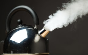 boiling kettle with dense steam