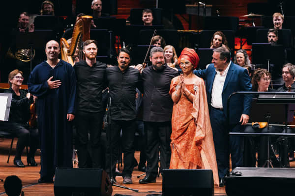 From left, vocalist Abdelilah Rharrabti, saz player Liam Oliver, vocalist and daf player Esmail Fathi, oud player Kyriakos Tapakis, vocalist Oum and composer John Psathas at the Michael Fowler Centre in Wellington 9 March 2024