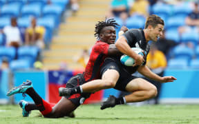 Andrew Knewstubb of New Zealand on his way to score a try.