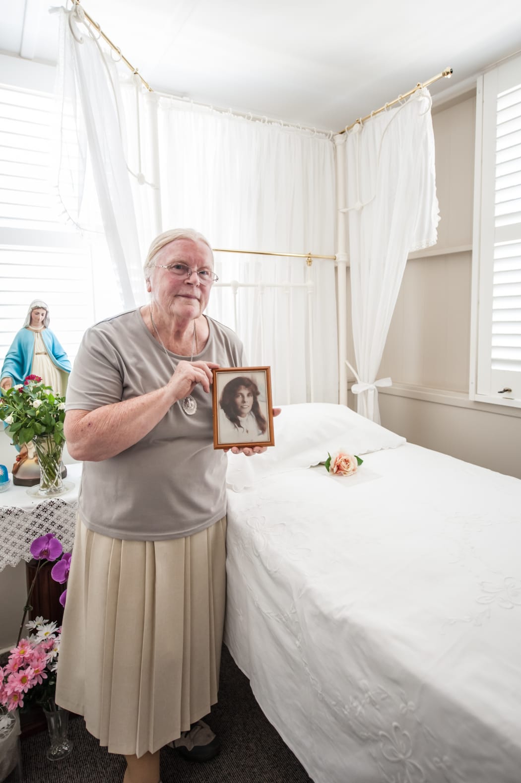 Sister Margaret Mary Birgan at Eileen O'Connor's bed