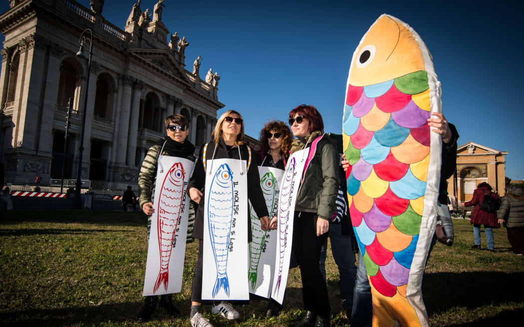 People gather in St. John at the Lateran Square for a demonstration of the Sardines an Italian grass-roots movement against right-wing populism,  on December 14, 2019 in Rome