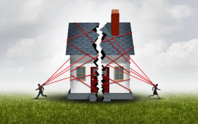 Broken family after a bitter divorce settlement and separation with a couple in a bad relationship breaking a house apart showing the concept of a marriage dispute and dividing assets with 3D illustration elements.