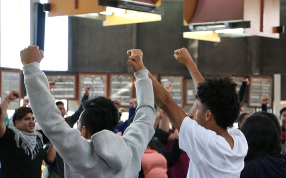 Pacific youth in Christchurch take part in a warm up game of rock, paper, scissors before question time at the Pacific Youth Parliament simulation.