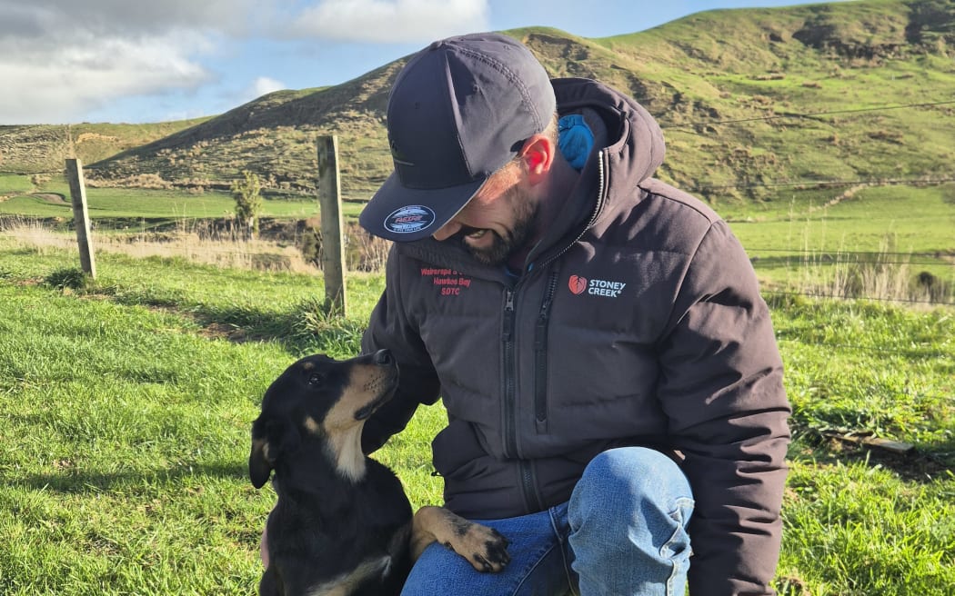 Wairarapa farmer and dog triallist Chris Shaw with his latest pup, 7-month-old Huntaway Miley.